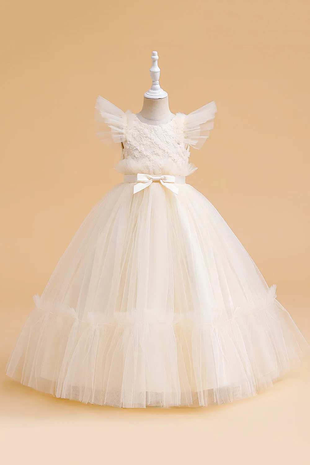 Abito bambina in tulle champagne con fiocco