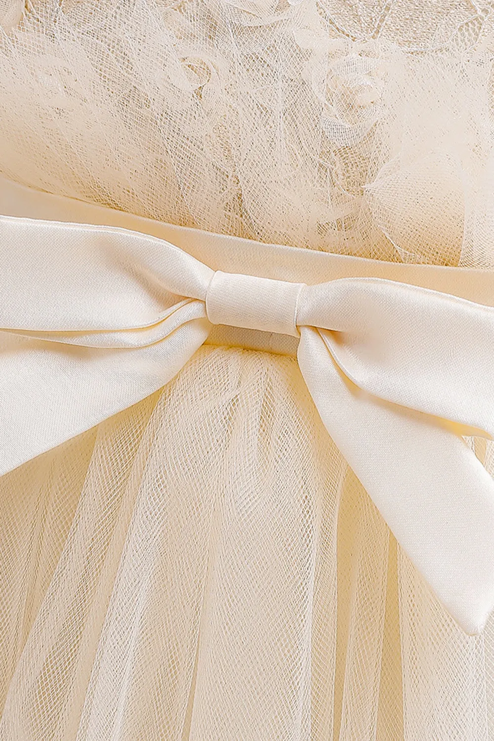 Abito bambina in tulle champagne con fiocco