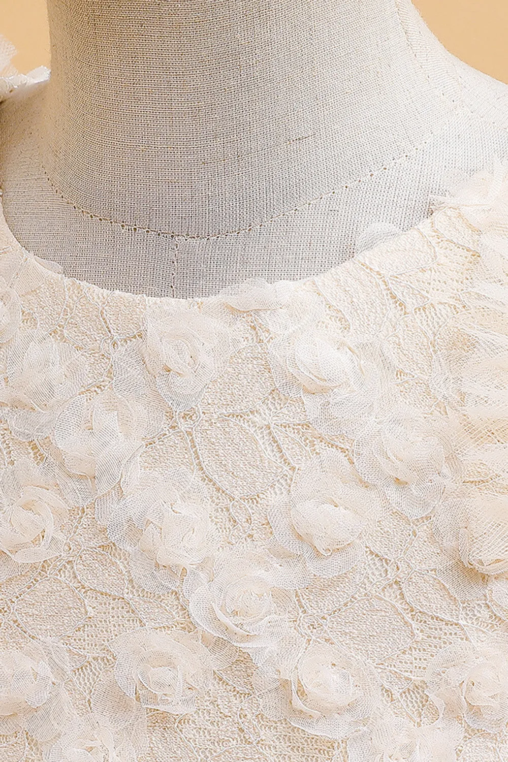 Abito bambina in tulle champagne con fiocco