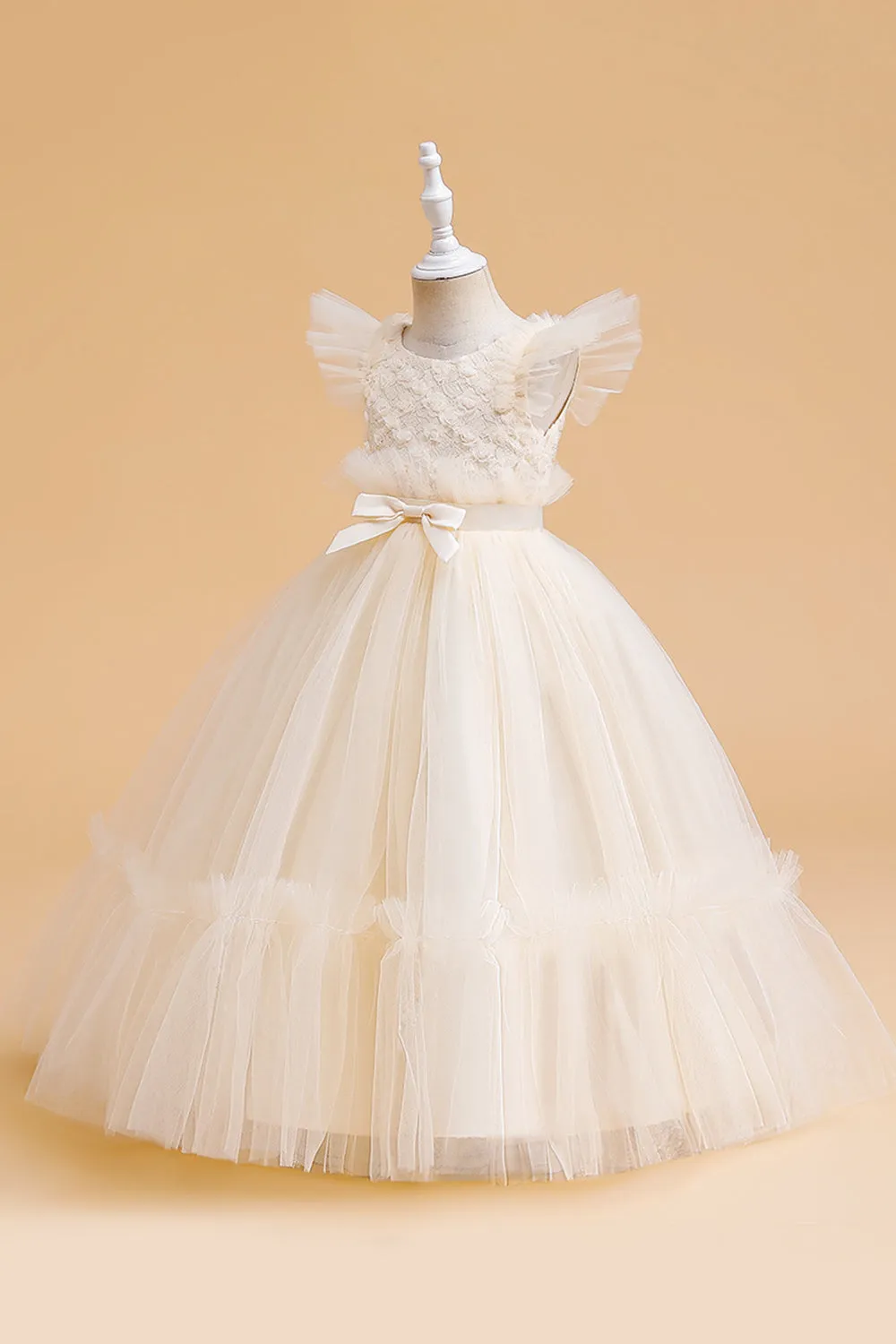 Abito bambina in tulle champagne con fiocco