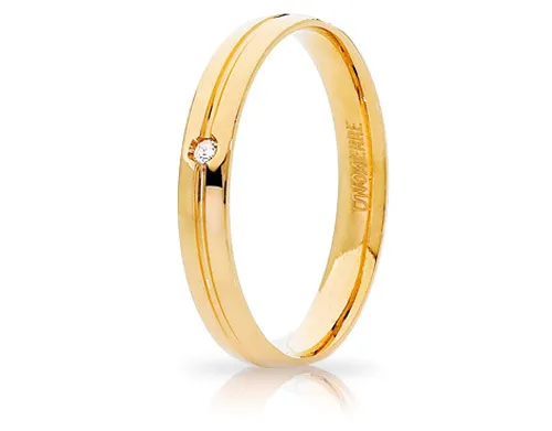 Fede Nuziale Unoaerre modello Lyra in oro giallo 18kt con brillante