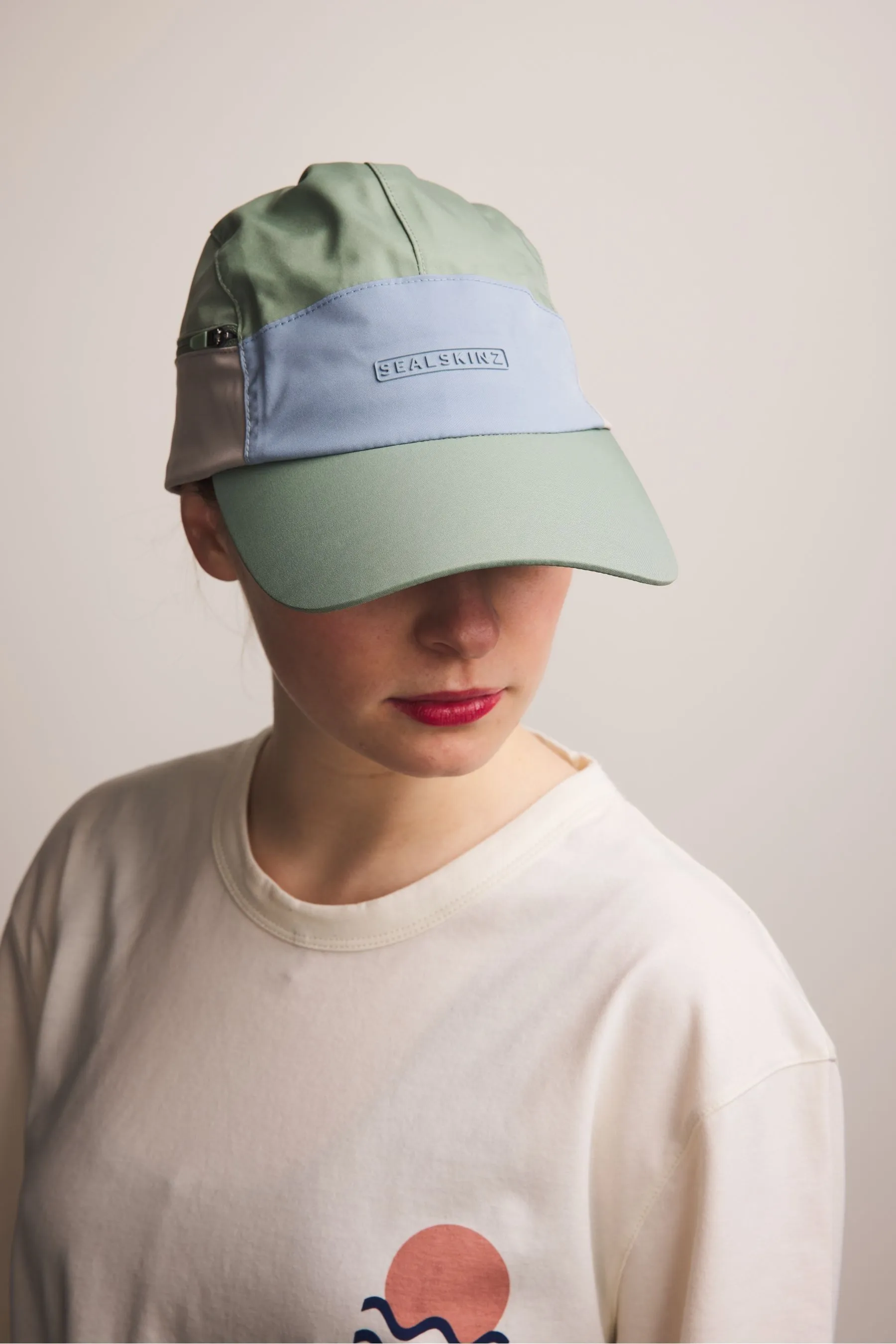 Sealkinz - Scole - Cappellino impermeabile con tasca e zip